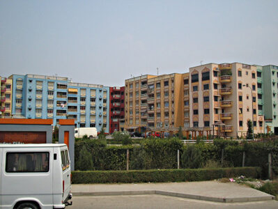 A row of many-coloured new residential buildings.