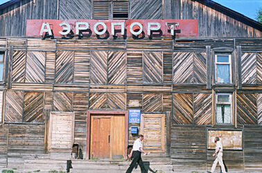 A large wooden building, with "airport" written in big letters.